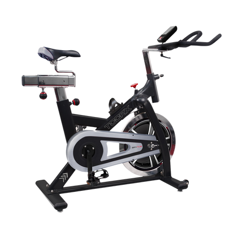 Svart Toorx SRX-70S spinningcykel i sidovy med svänghjul och justerbart styre